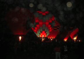 2 small orbs coming to visit at Taos Hot air balloon rally