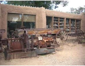 old adobe building filled with turquoise and other mining stuff
