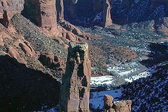 A rock formation in the middle of a desert.