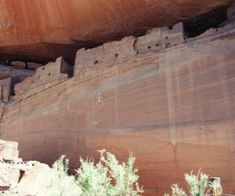 A large rock wall with many small rocks.