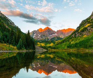 marron bells mountains reflecting in the lake